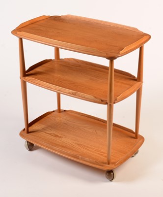 Lot 77 - Ercol: a light elm and beech Model 458 trolley.