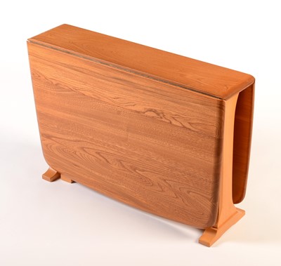 Lot 78 - Ercol: a light beech and elm drop-leaf occasional table.