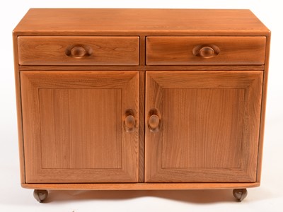 Lot 81 - Ercol: a light elm side cabinet