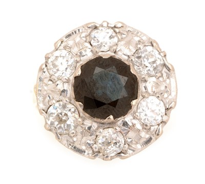 Lot 84 - A sapphire and diamond cluster ring