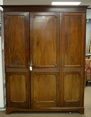 Lot 60 - A 20th Century mahogany three door wardrobe