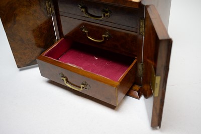 Lot 515 - A 19th Century burr walnut miniature chest of drawers
