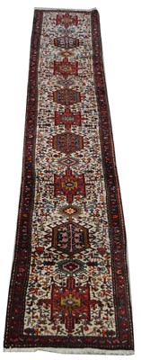 Lot 428 - A Heriz runner