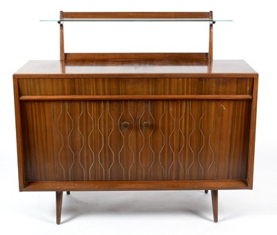 Lot 655 - Everest: a mid Century walnut Helix pattern sideboard.