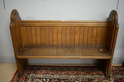 Lot 243 - An oak pew