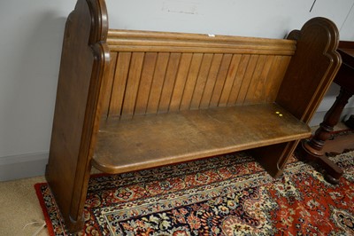 Lot 243 - An oak pew