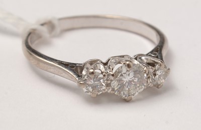 Lot 83 - A three-stone diamond ring.