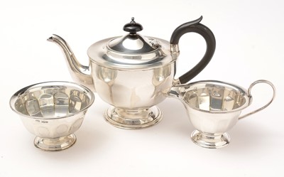 Lot 193 - A George V silver three-piece tea set.