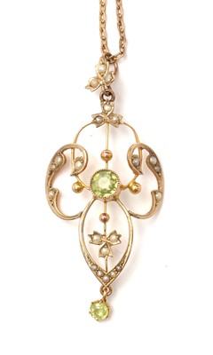 Lot 115 - An Edwardian Art Nouveau peridot and pearl pendant.
