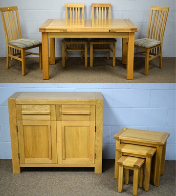 Lot 36 - A 20th Century light oak dining room suite