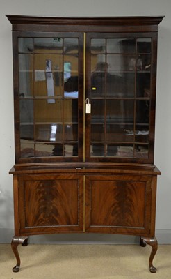 Lot 247 - An Edwardian mahogany concave fronted bookcase
