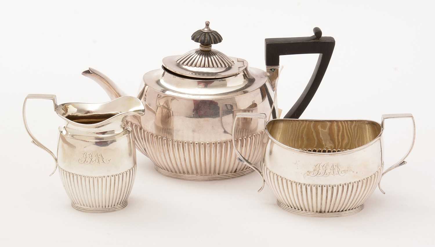 Lot 24 - A silver bachelor's three piece tea service.