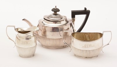 Lot 24 - A silver bachelor's three piece tea service.