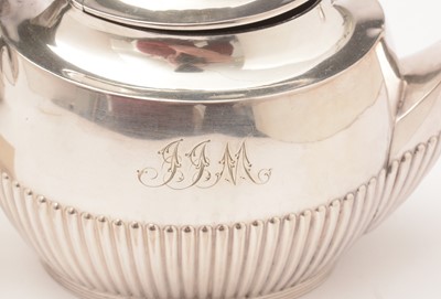 Lot 24 - A silver bachelor's three piece tea service.