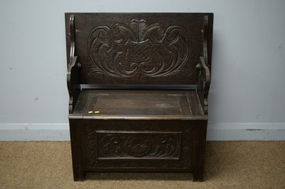 Lot 213 - A carved oak monk's bench