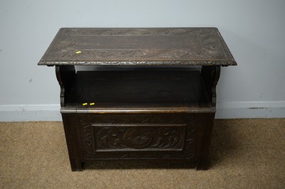 Lot 213 - A carved oak monk's bench