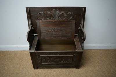 Lot 213 - A carved oak monk's bench