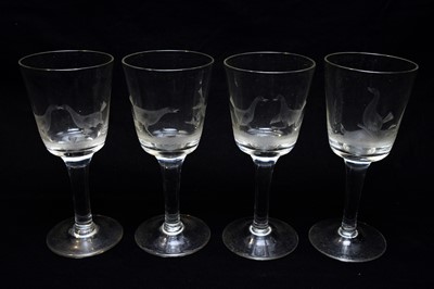 Lot 542 - Four engraved cock fighting wine glasses