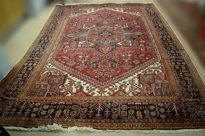 Lot 125 - A Heriz carpet.