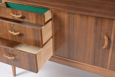 Lot 629 - 1950's walnut sideboard; and matching dining table.