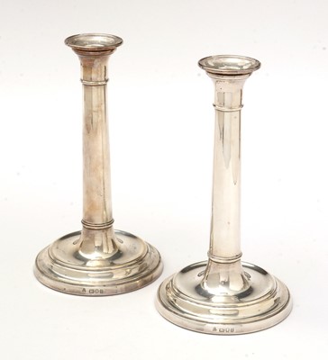 Lot 2 - A pair of Elizabeth II silver candlesticks.
