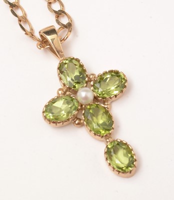 Lot 55 - A peridot and cultured pearl set crucifix pendant