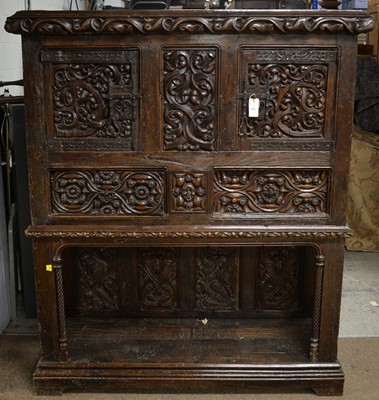 Lot 220 - A substantial ornate oak carved cupboard