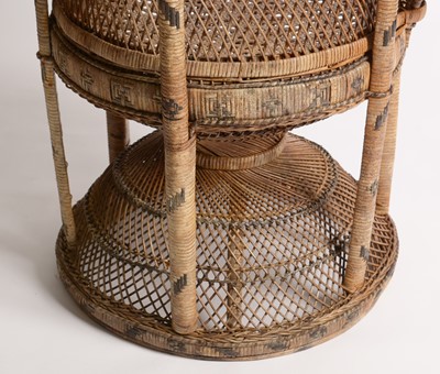 Lot 637 - An Emmanuelle wicker peacock chair, 1970's