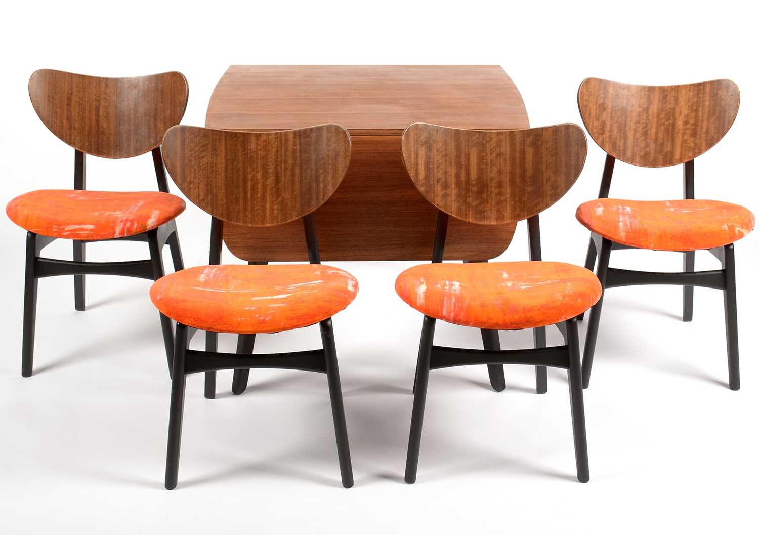 Lot 639 - G-Plan: a 'Librenza' tola wood and black lacquered drop leaf table and four dining chairs.