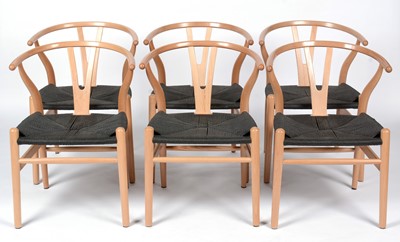 Lot 641 - Six modern CH25 style beech and black cord wishbone chairs .