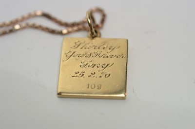 Lot 194 - A Jack Spencer 9ct gold ingot pendant on chain.