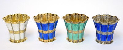Lot 173 - A set of four silver gilt and enamel cups