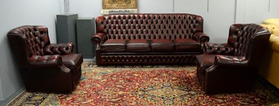 Lot 51 - A Chesterfield style oxblood three-piece suite