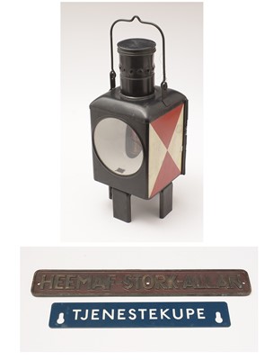 Lot 351 - A German railway signal lamp, plates, and two model trains