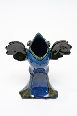 Lot 501 - A C. H. Brannam Barnstaple grotesque spoon warmer.