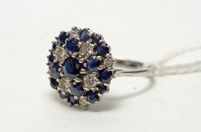 Lot 145 - A sapphire and diamond cluster ring