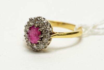 Lot 146 - A ruby and diamond dress ring