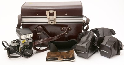 Lot 377 - An Olympus OM-2n SLR film camera with lens and flash gun