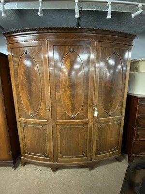 Lot 87 - An early 20th Century mahogany bow-front wardrobe