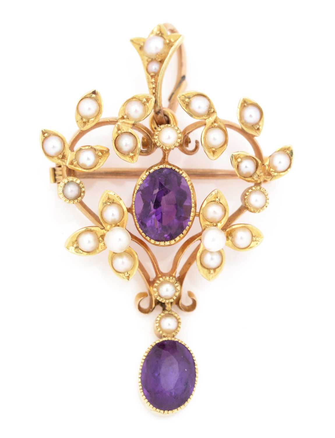 Lot 77 - An Edwardian amethyst and seed pearl pendant/brooch