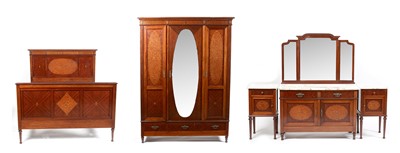 Lot 655 - An ornate French Empire-style bedroom suite.