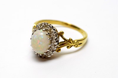 Lot 259 - An opal and diamond cluster ring