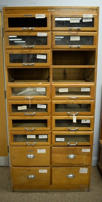 Lot 77 - A vintage light oak haberdashers cabinet