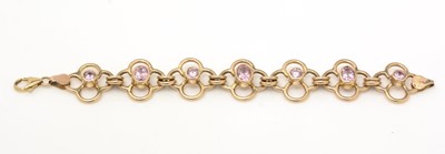 Lot 308 - A 9ct yellow gold and pink stone bracelet