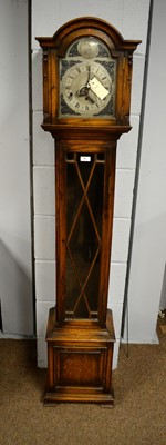 Lot 70 - Greenwood & Sons, Leeds & Huddersfield: an early 20th Century oak Grandmother clock