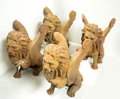 Lot 340 - A set of four Roman style cast metal lion gargoyles.