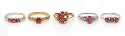 Lot 102 - Five ruby and white stone rings