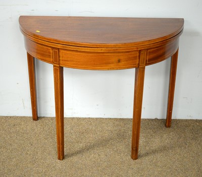 Lot 54 - A Georgian mahogany and banded demi-lune tea table