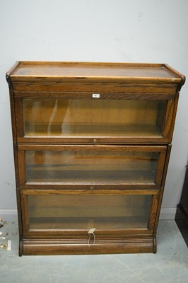Lot 89 - An oak three-tier bookcase by Gunn Furniture Co., USA.