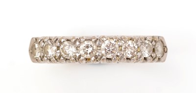 Lot 431 - A diamond half hoop eternity ring